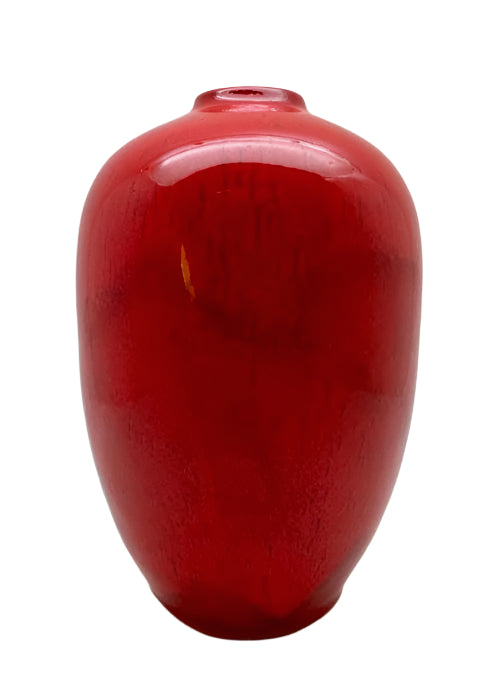 A tall, egg-shaped ceramic vase with a glossy red finish and a smooth texture.