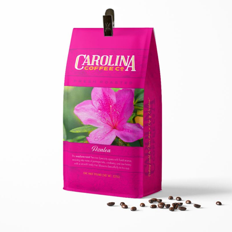 Pink Carolina Coffee Co. bag with a pink flower design on a white background