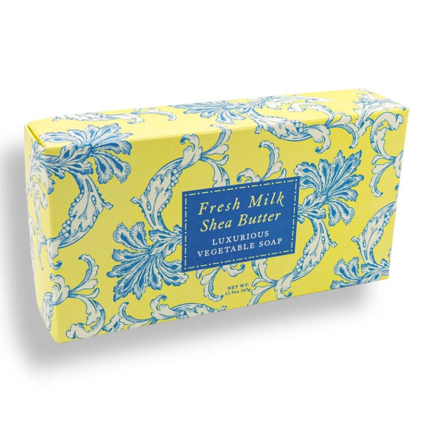 Yellow soap box with blue floral pattern and 'Fresh Milk Shea Butter' label on a white background