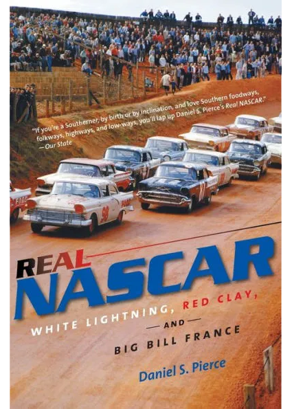 Cover of the book 'Real NASCAR; White Lightning, Red Clay, and Big Bill France' by Daniel S. Pierce featuring old-time NASCAR race cars on a dirt track.