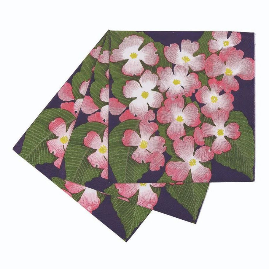 Two floral-patterned napkins with pink flowers and green leaves on a white background