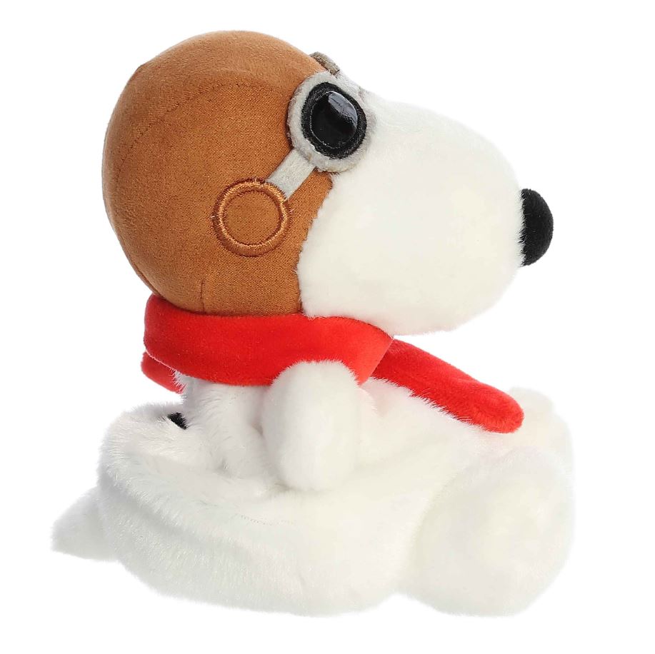 Plush dog toy with a red scarf on a white background