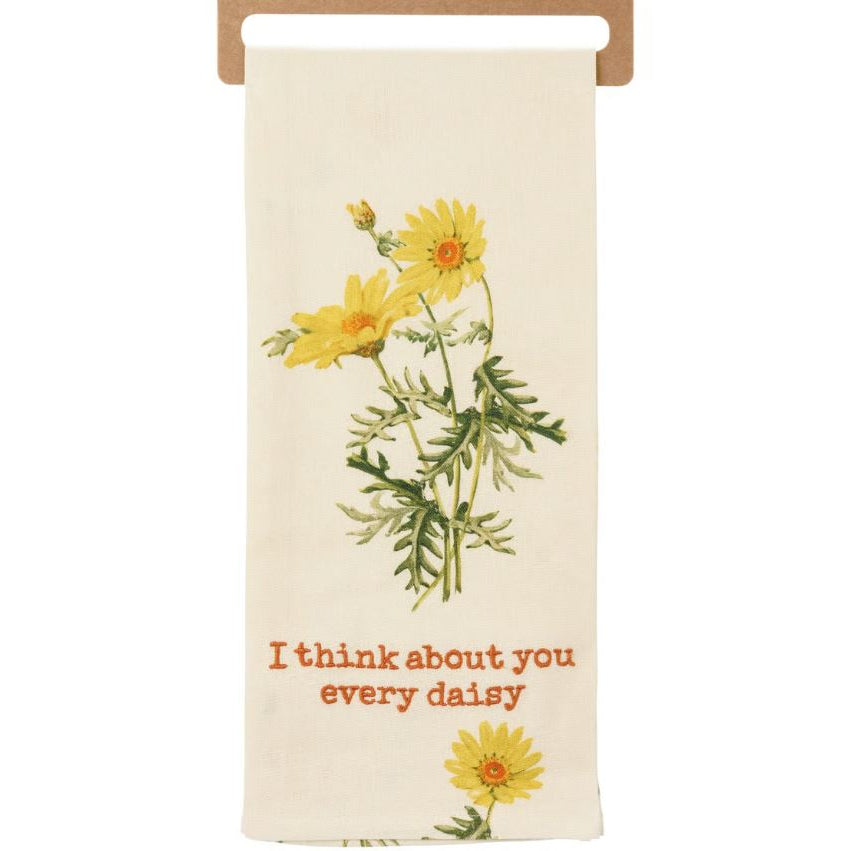 Floral-themed towel with yellow daisies and text on a white background
