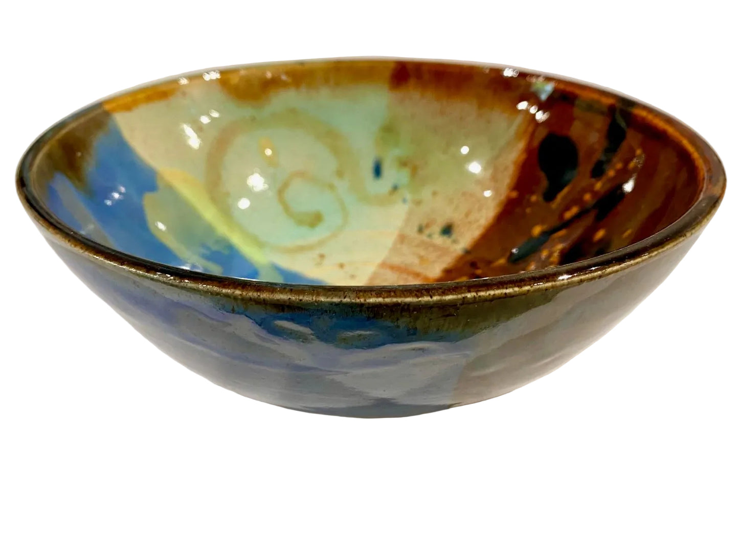 Ceramic bowl with multicolored glaze on a white background