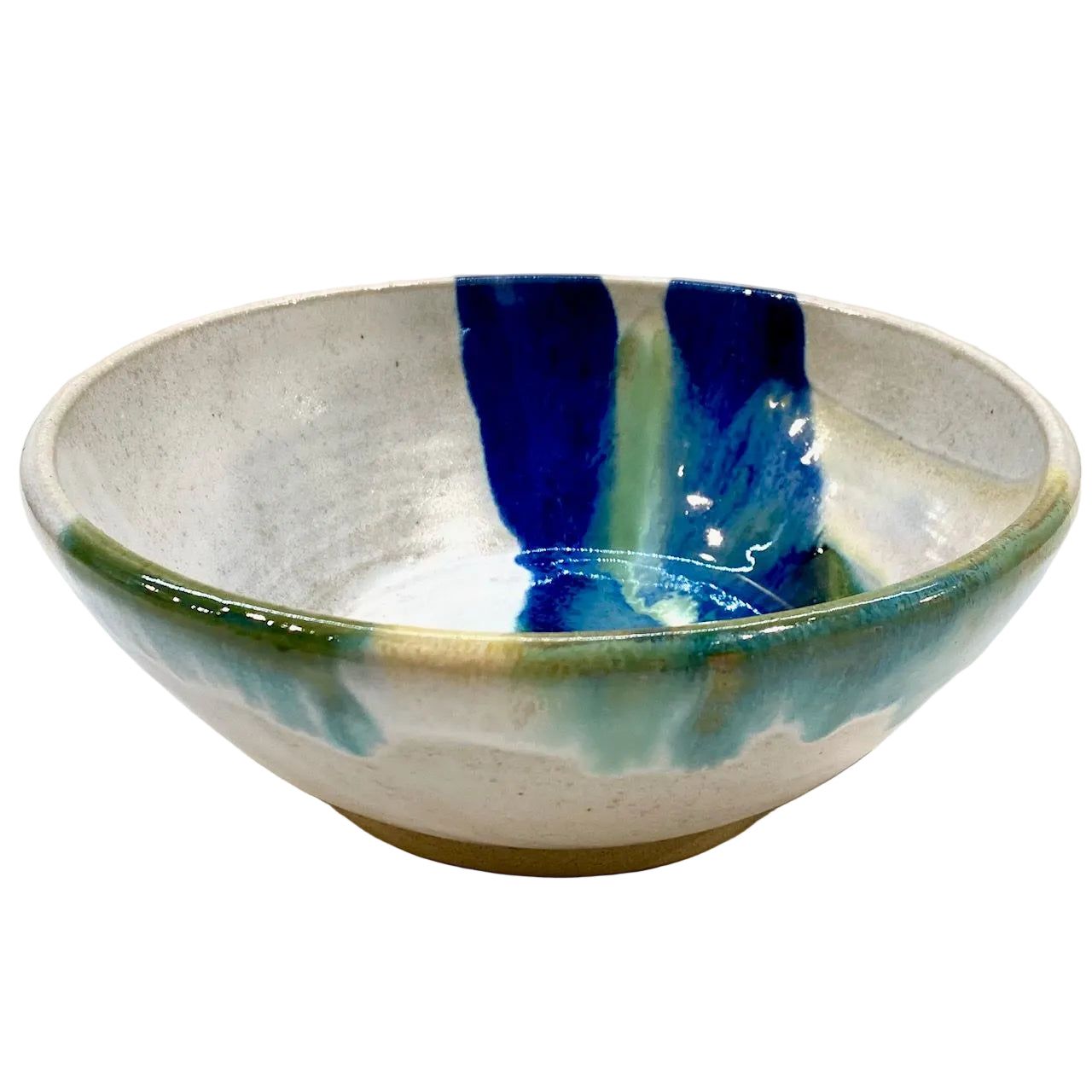 A handmade ceramic bowl with a speckled off-white glaze, featuring bold vertical drips of deep blue, teal, and green on the inside, and a green rim with a gold-toned edge.