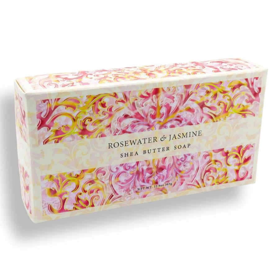 Shea butter soap bar with floral packaging on a white background