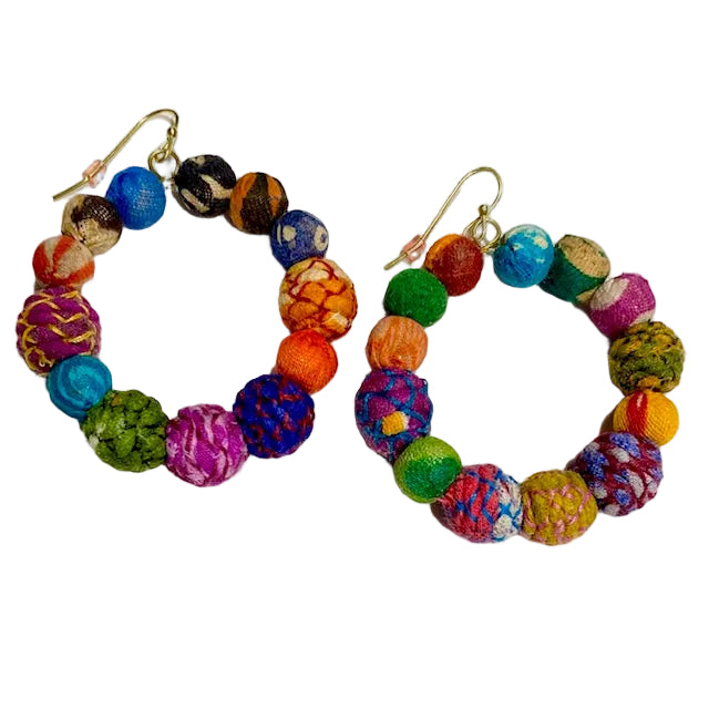 Colorful beaded earrings on a white background