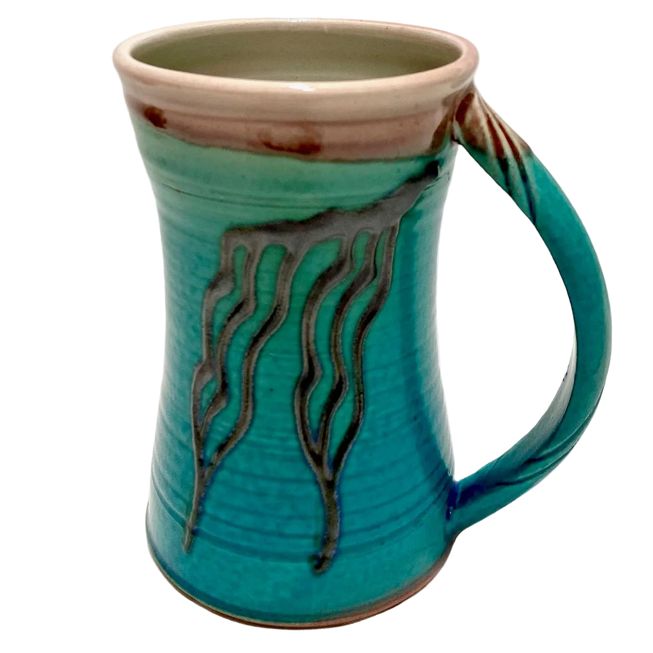 Turquoise ceramic mug with decorative handle on a white background