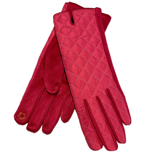 Pair of pink quilted gloves on a light gray background