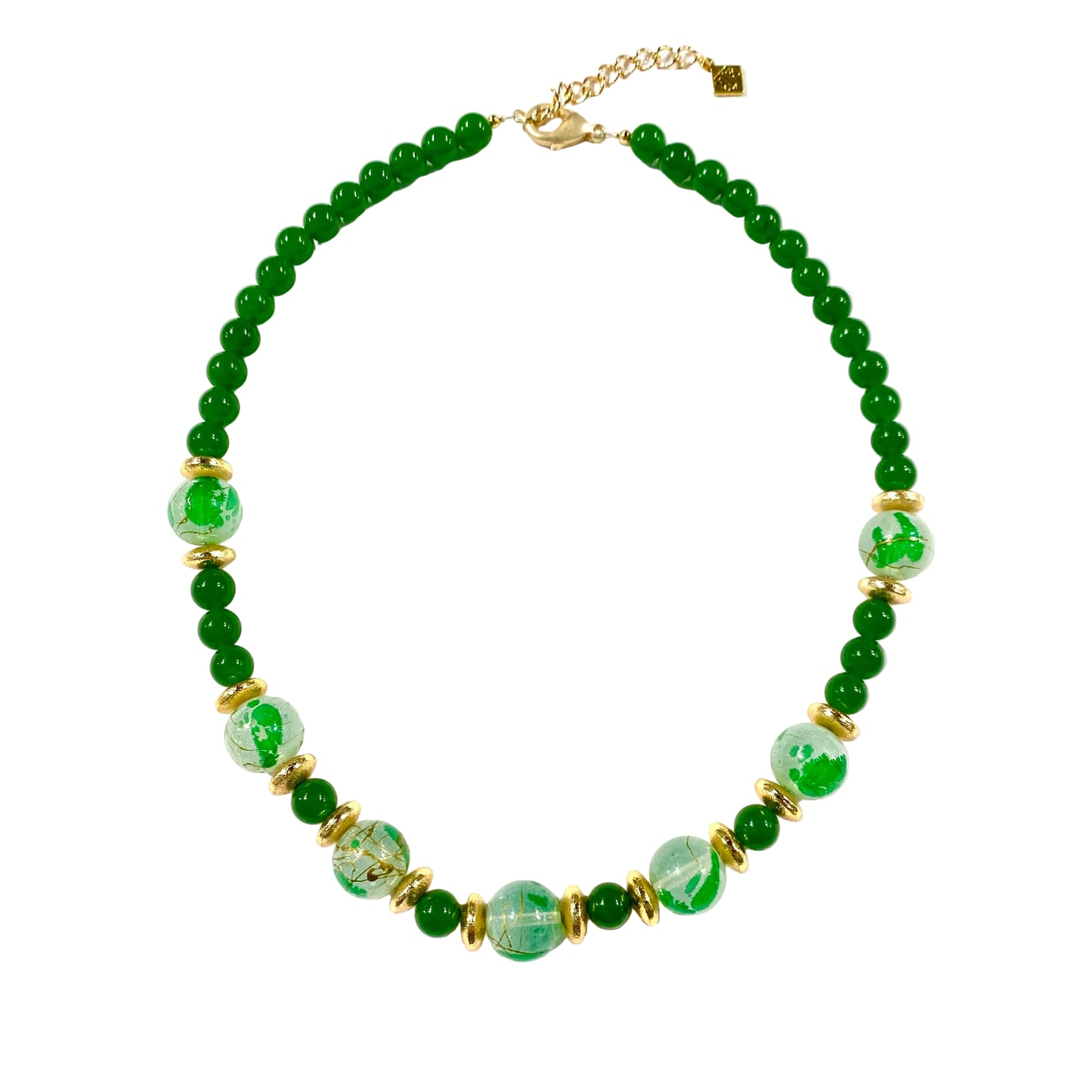 Necklace with green beads and gold accents on a white background