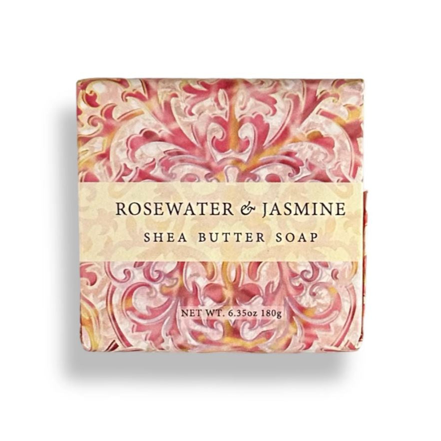 Shea butter soap bar with decorative packaging on a white background