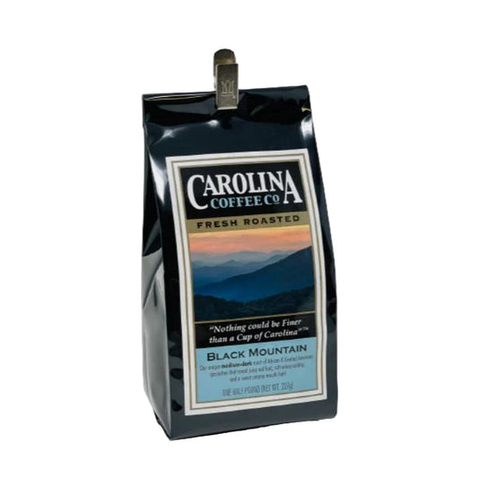 Carolina Coffee Co. black coffee bag with scenic design on a white background