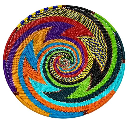 Colorful woven basket with a spiral pattern on a white background