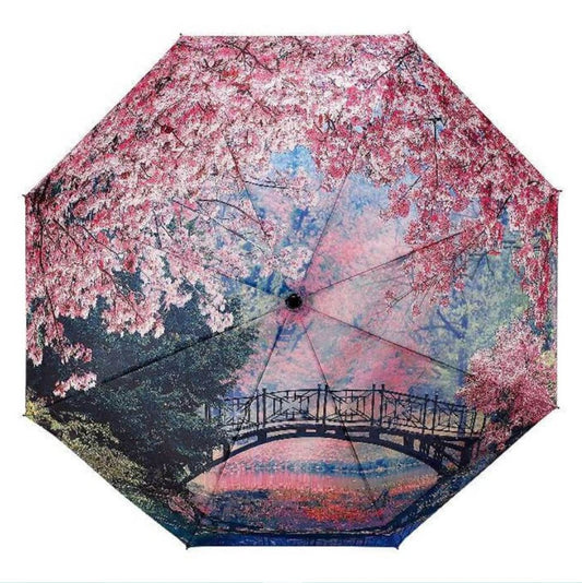 Umbrella with cherry blossom and bridge design on a white background