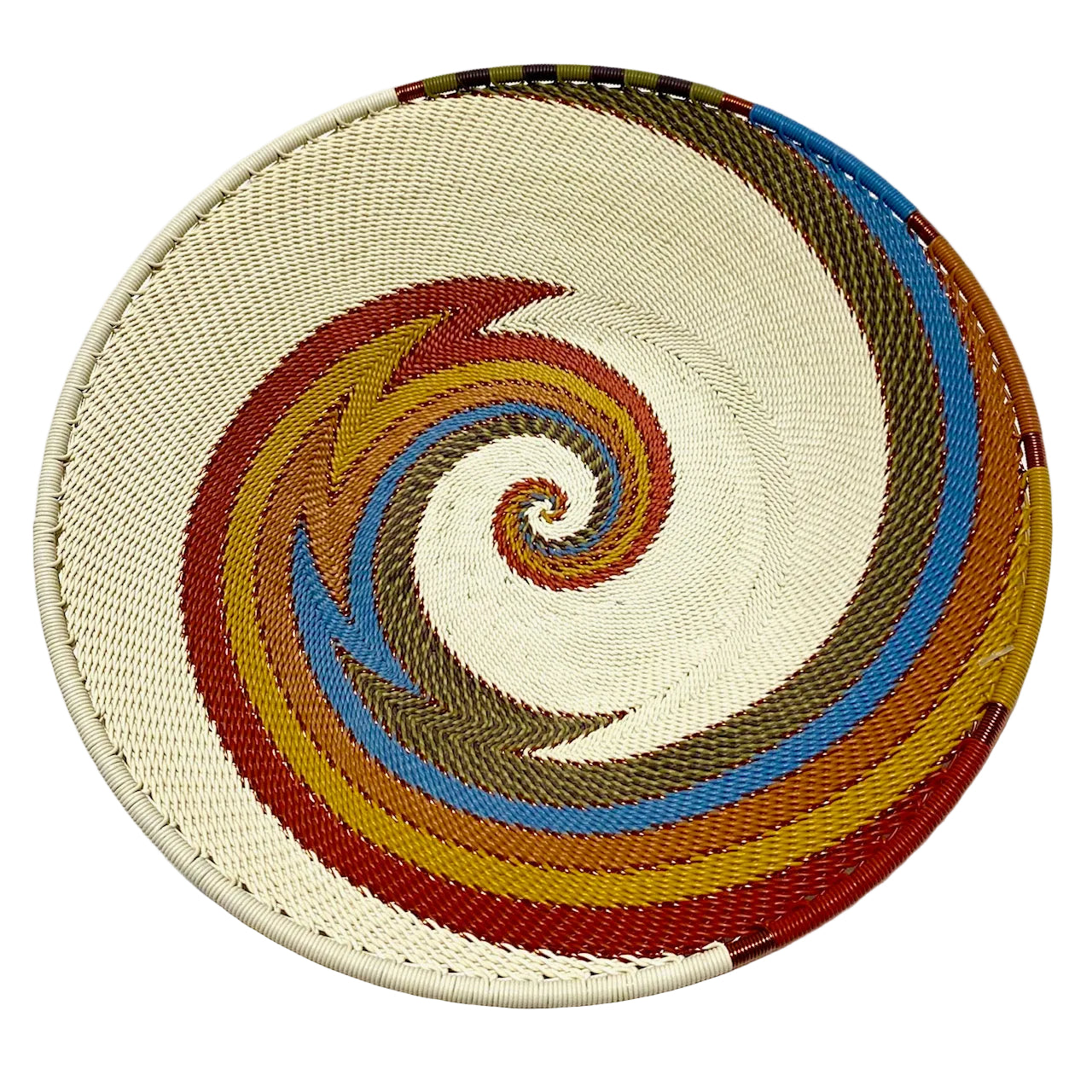 Woven basket with a spiral pattern in various colors on a white background