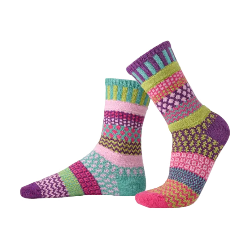 Pair of colorful patterned socks on a light gray background