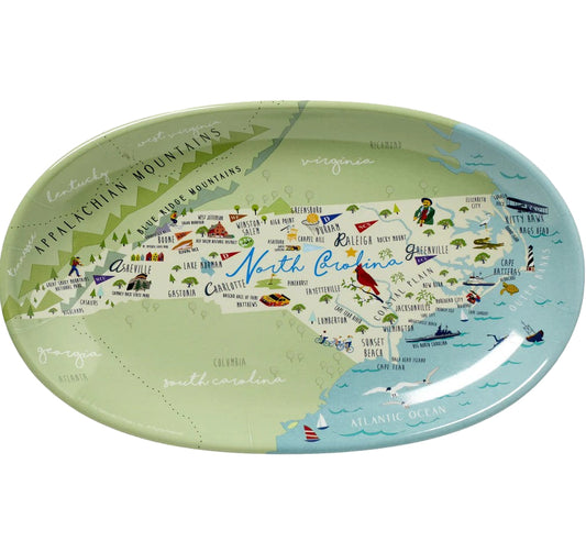 Map of North Carolina on a decorative plate with various symbols and colors.