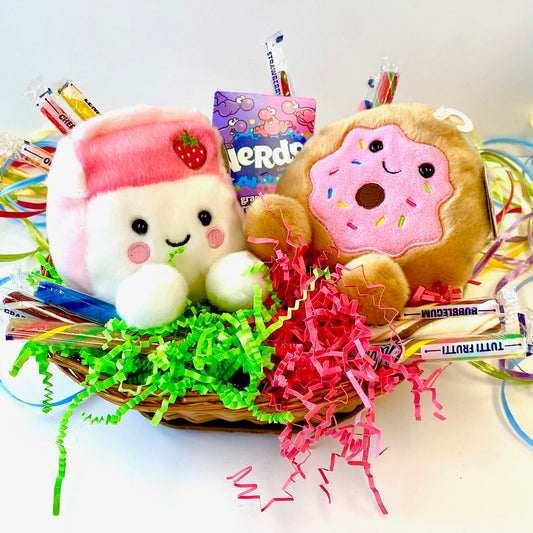 Basket with plush toys, candy on a white background
