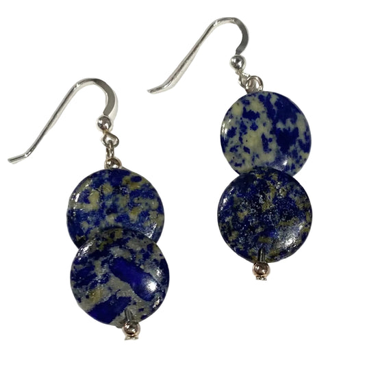 Pair of earrings with blue speckled stones on a white background