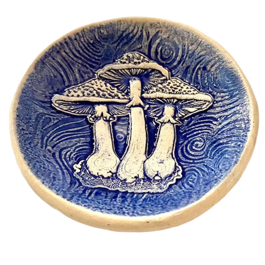 Ceramic bowl with mushroom design on a blue background