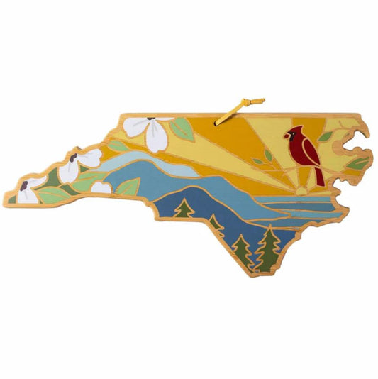 Decorative wall art shaped like a state with a cardinal and nature elements on a white background