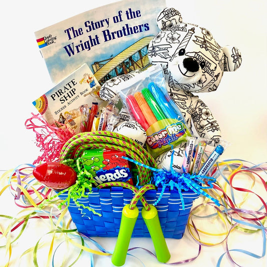 Colorful gift basket with books, toys, and stationery on a white background