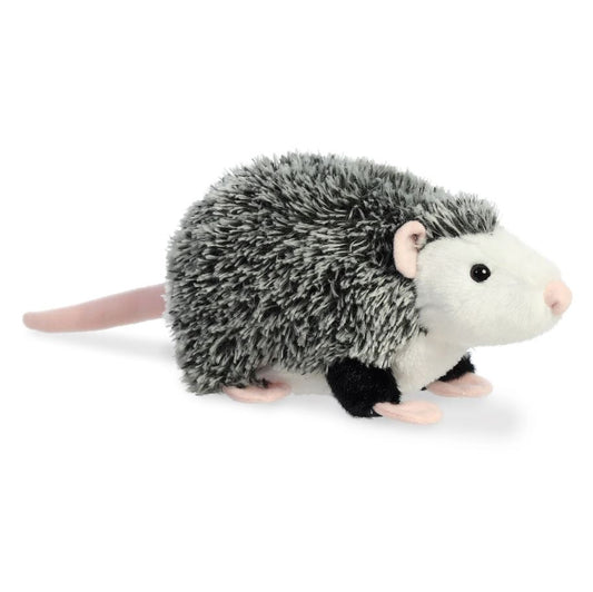 Plush toy opossum on a white background