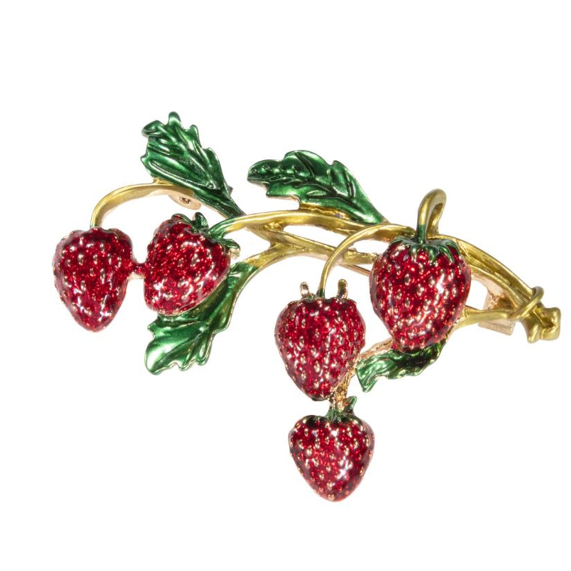 Brooch with red strawberry design on a white background