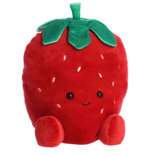 Plush strawberry toy with a smiling face on a white background