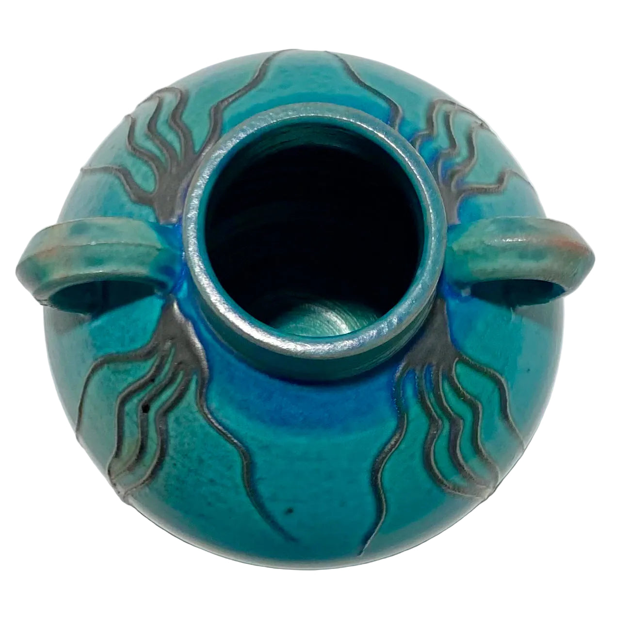 Turquoise ceramic vase with decorative patterns on a white background