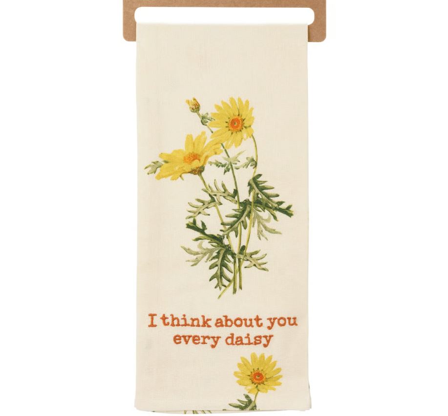 Floral-themed towel with yellow daisies and text on a white background