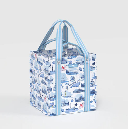 A reusable tote bag with a blue and white illustrated pattern, featuring light blue handles and side trim, shown on a light gray background.